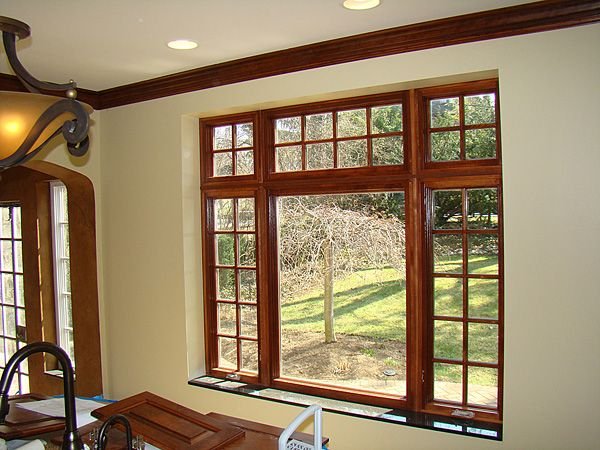 Wooden window with shutter design for contemporary homes 
