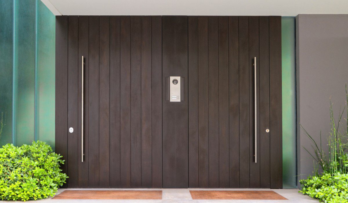 Wood Double Doors Create Warm Contrast On Elegant Home