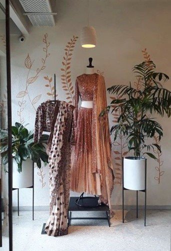 Modern fashion boutique showcases elegant clothing collection in