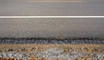 What is road cross-section, and what are its elements?